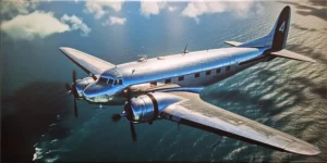 AS600877901 | Vintage DC-3 Plane in Flight Over the Ocean